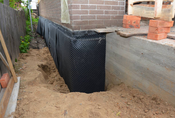 Happy homeowners after waterproofing job in Kenton